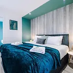 Rest & Recharge At The Station Apartments