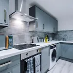 Rest & Recharge At The Station Apartments